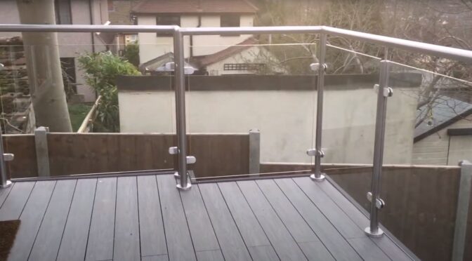 What are some popular deck woods to pair with glass balustrades?